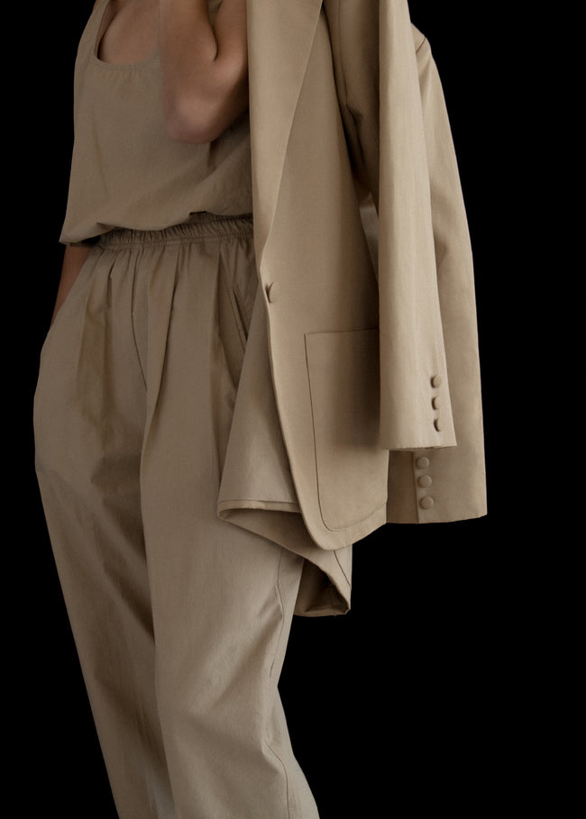 Beige X Hailey Bieber pleated wool suit trousers | WARDROBE.NYC | MATCHES UK